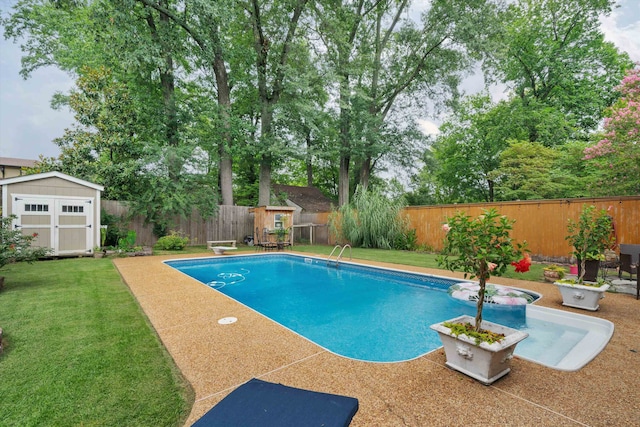 view of pool with a storage unit, a diving board, and a yard