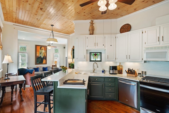 kitchen with sink, white cabinets, stainless steel appliances, and dark hardwood / wood-style floors