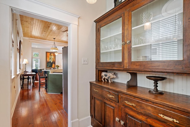 hall with hardwood / wood-style floors and wood ceiling