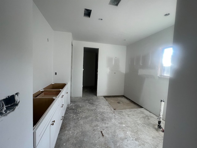 full bathroom with walk in shower, vanity, and unfinished concrete floors