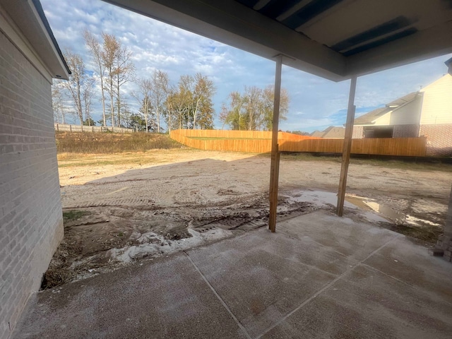 view of yard with a patio and fence