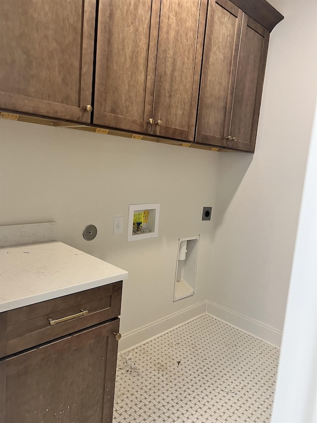 laundry room with cabinet space, hookup for a washing machine, baseboards, and hookup for an electric dryer