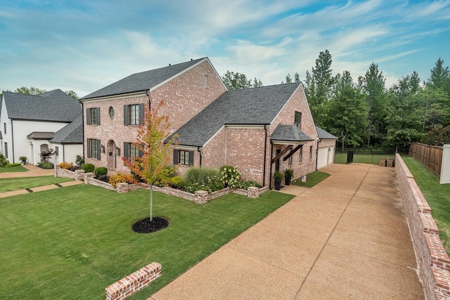 french provincial home featuring a front yard