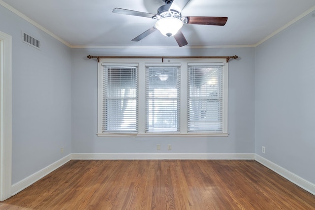 unfurnished room featuring hardwood / wood-style floors, ceiling fan, and ornamental molding