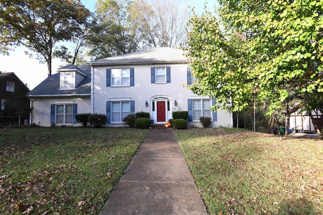 view of front of home with a front lawn