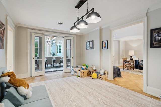 recreation room with crown molding, light parquet floors, and an inviting chandelier