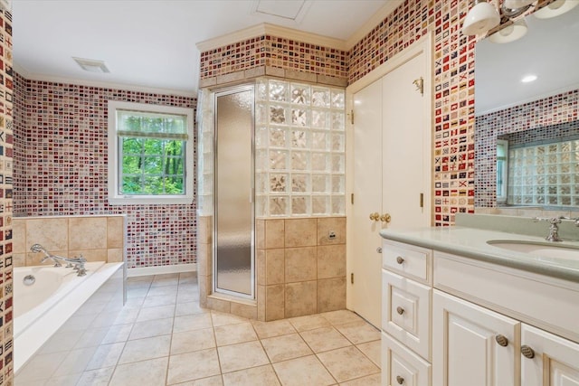 bathroom with vanity, tile patterned flooring, plus walk in shower, and tile walls