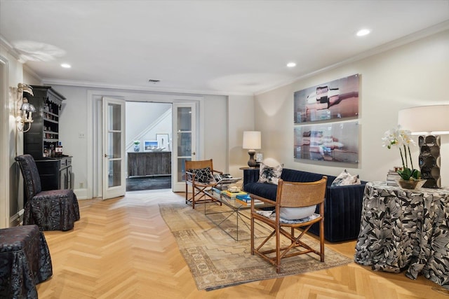 living room with ornamental molding and parquet flooring