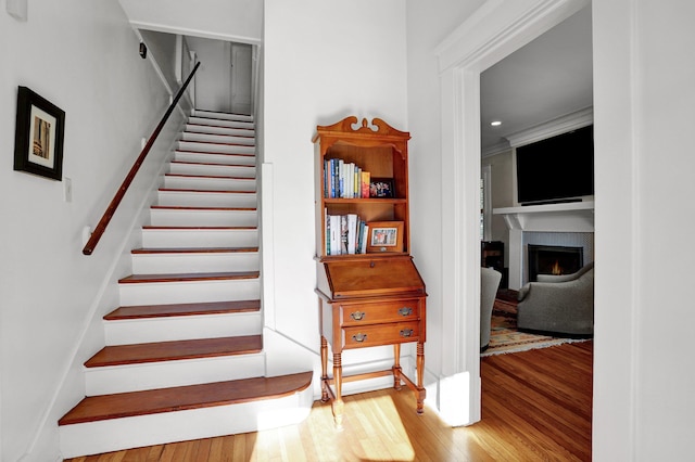 staircase with wood-type flooring