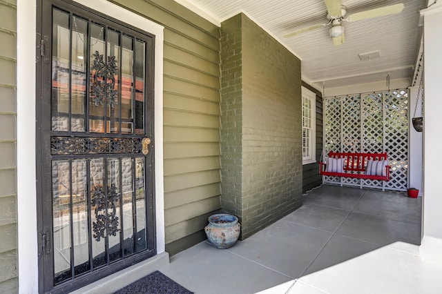 entrance to property featuring covered porch