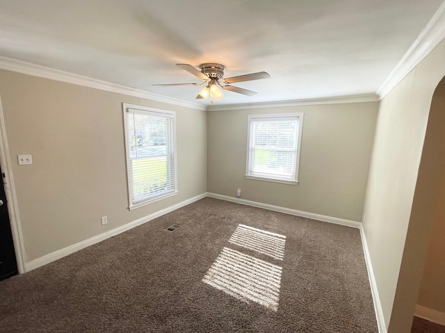 unfurnished room with ceiling fan, carpet floors, and crown molding