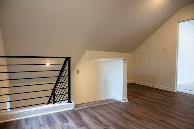 additional living space featuring hardwood / wood-style flooring and lofted ceiling