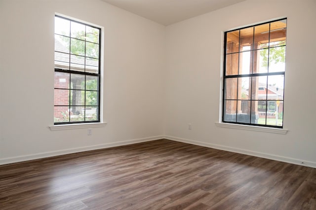 spare room featuring dark hardwood / wood-style floors