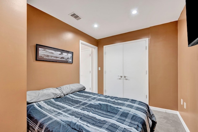 bedroom with a closet and carpet floors