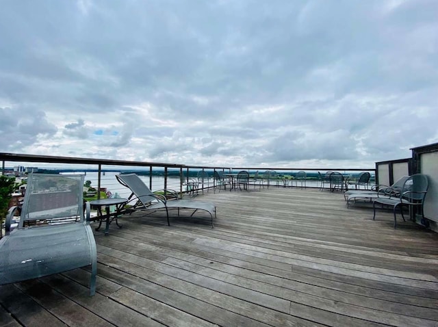 wooden deck with a water view