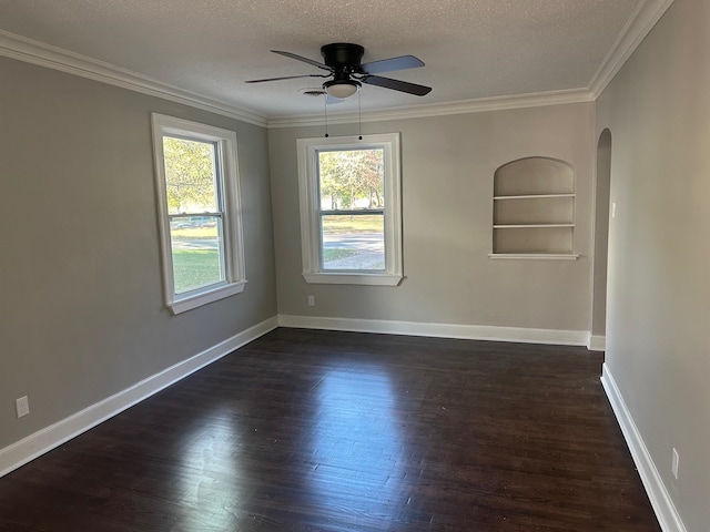 unfurnished room with a textured ceiling, dark hardwood / wood-style floors, ceiling fan, and crown molding