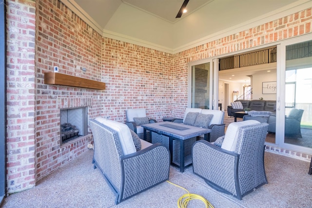 view of patio with an outdoor living space with a fireplace