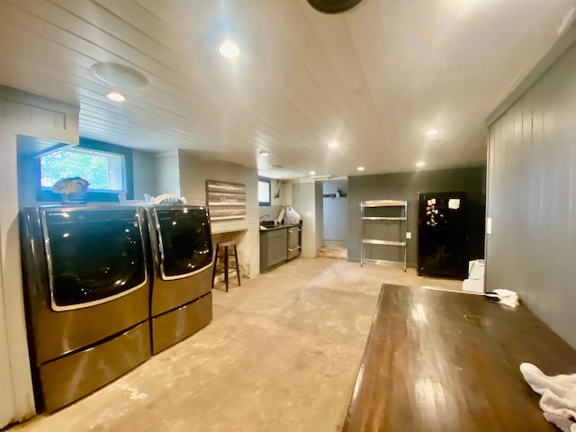 clothes washing area featuring separate washer and dryer