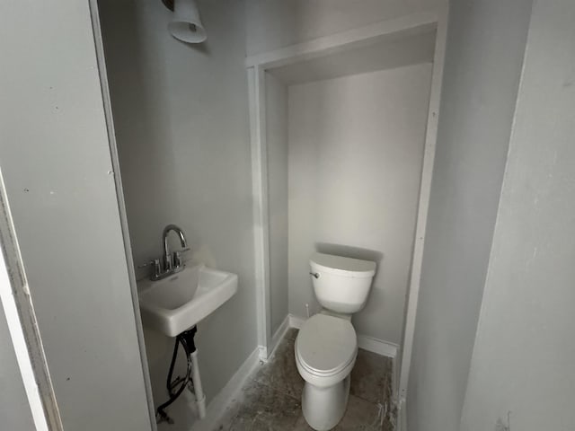 bathroom with tile patterned floors and toilet