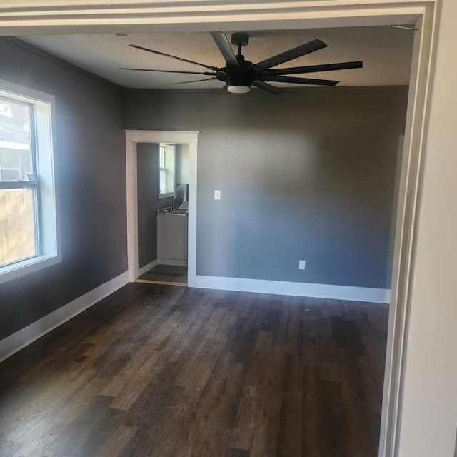 spare room with hardwood / wood-style floors and a textured ceiling