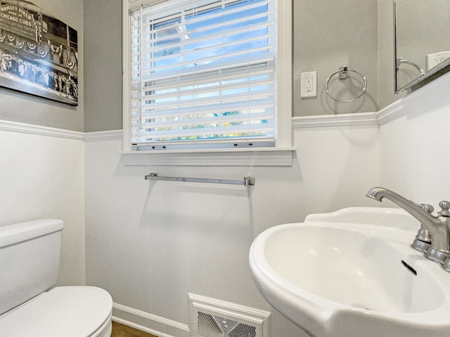 bathroom with toilet and sink