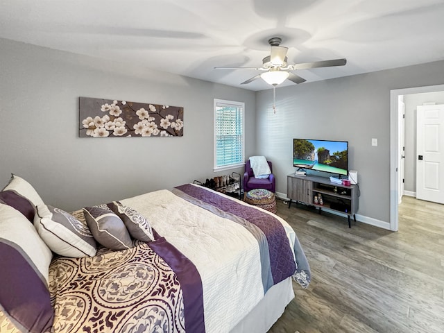 bedroom featuring hardwood / wood-style floors and ceiling fan