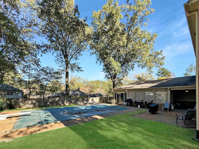 view of yard with a patio and a covered pool