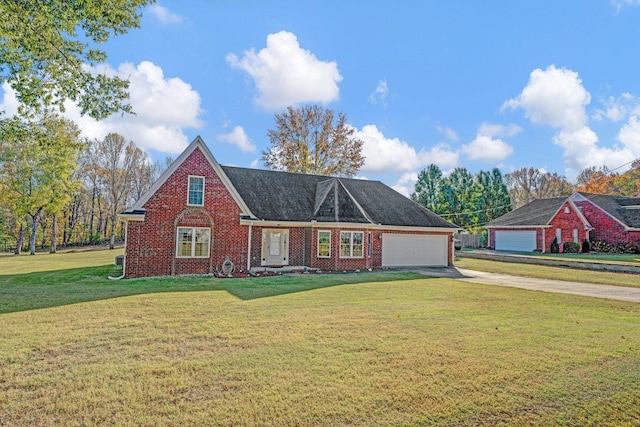 view of front of house featuring a garage and a front lawn