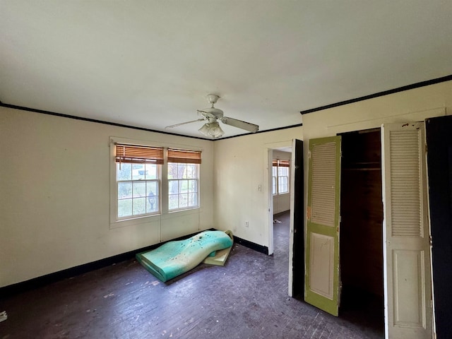 unfurnished bedroom with a closet and ceiling fan