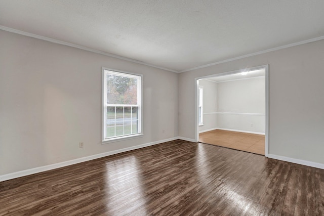 unfurnished room featuring crown molding, dark hardwood / wood-style flooring, and a textured ceiling