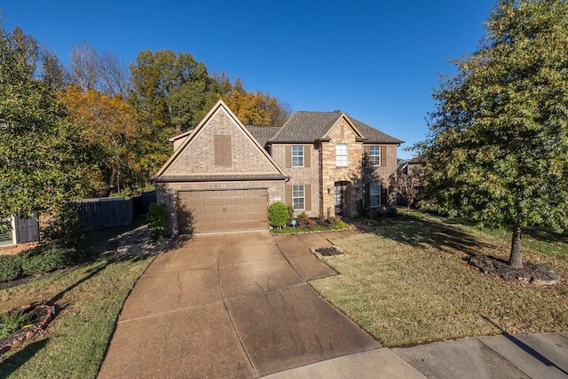 view of front of home with a front yard and a garage