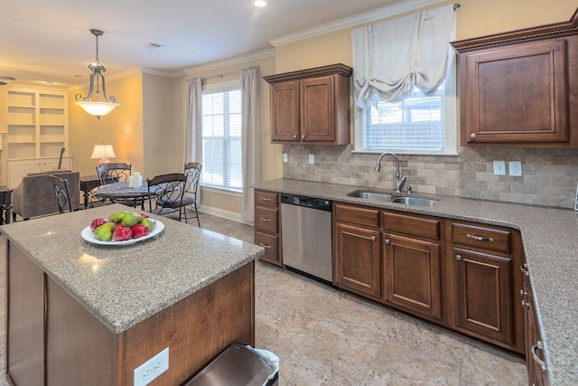 kitchen with decorative backsplash, ornamental molding, sink, dishwasher, and a kitchen island