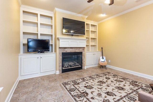 living room with built in shelves, ceiling fan, a fireplace, and ornamental molding