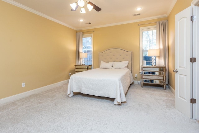 bedroom featuring light colored carpet, ceiling fan, and ornamental molding