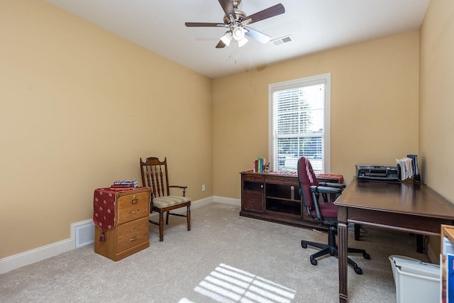 office featuring ceiling fan and light carpet