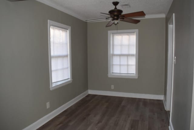 empty room with dark hardwood / wood-style floors, ceiling fan, ornamental molding, and a textured ceiling