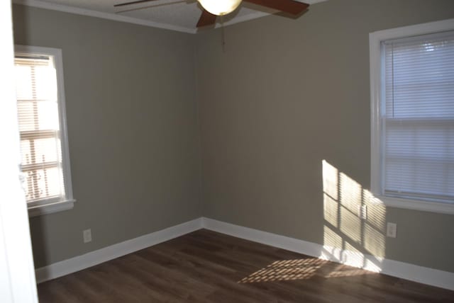 unfurnished room featuring crown molding, ceiling fan, and dark wood-type flooring