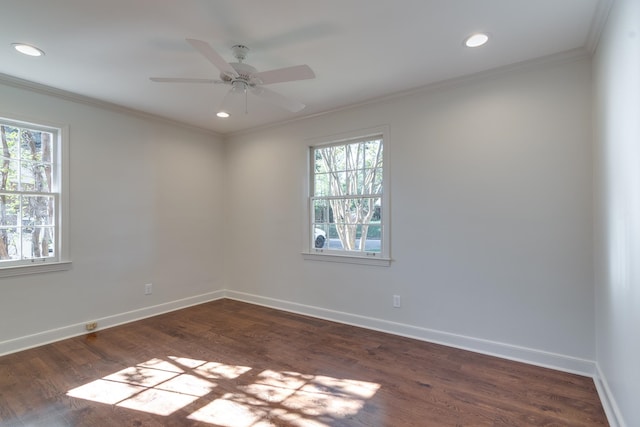 empty room with ceiling fan, dark hardwood / wood-style flooring, and ornamental molding