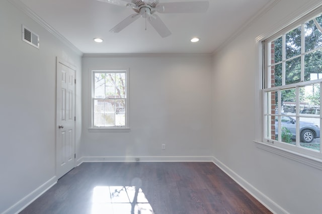 unfurnished room with crown molding, ceiling fan, and dark wood-type flooring