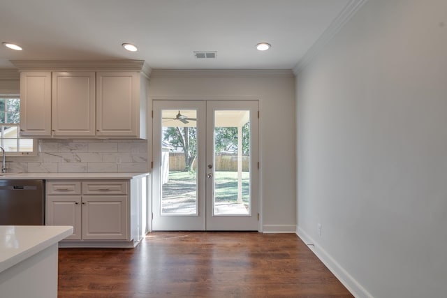 kitchen with dishwasher, white cabinetry, a wealth of natural light, and french doors