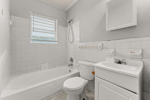 full bathroom with tiled shower / bath, vanity, tile walls, and toilet