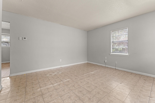 empty room featuring a textured ceiling