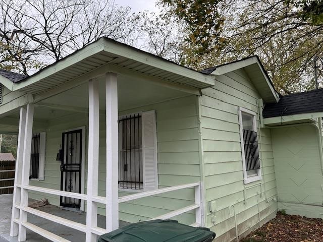 view of property exterior with a porch