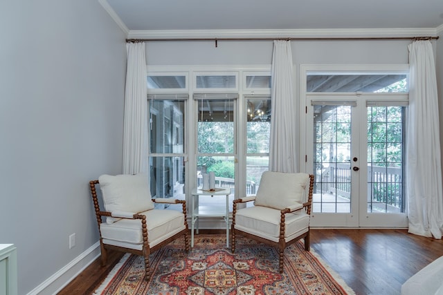 living area featuring dark hardwood / wood-style flooring, french doors, and ornamental molding