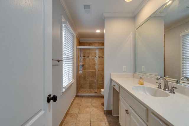 bathroom with tile patterned floors, an enclosed shower, ornamental molding, vanity, and toilet