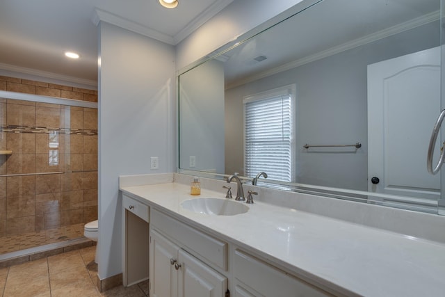 bathroom with tile patterned flooring, vanity, toilet, and ornamental molding