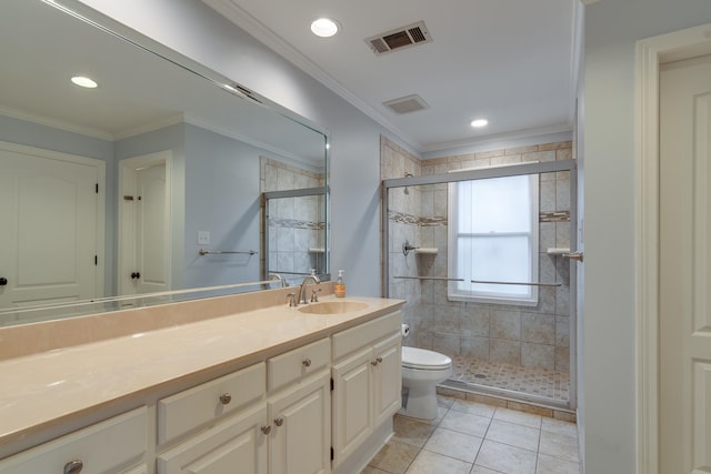 bathroom with tile patterned floors, vanity, toilet, and ornamental molding