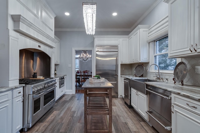 kitchen featuring white cabinets, light stone countertops, dark hardwood / wood-style floors, and high end appliances