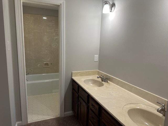 bathroom featuring vanity and a tub