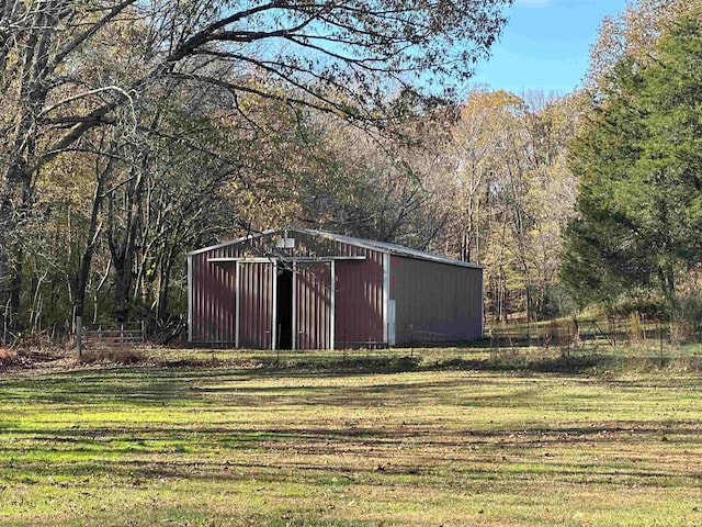 view of outdoor structure featuring a yard